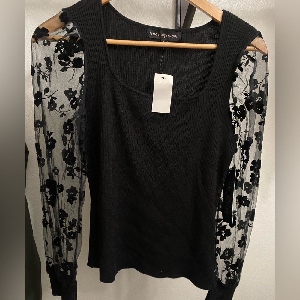 Black dressy sweater top with lace embroidered long sleeves never worn